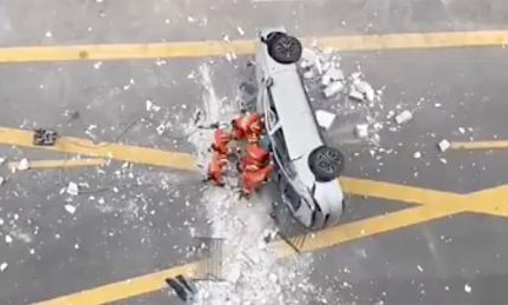 Two killed as Nio electric car crashes from third floor of a Shanghai building