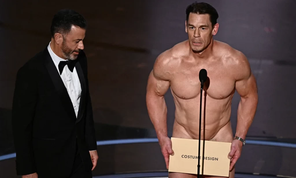 In his "birthday suit," John Cena presents an Oscar for costume design
